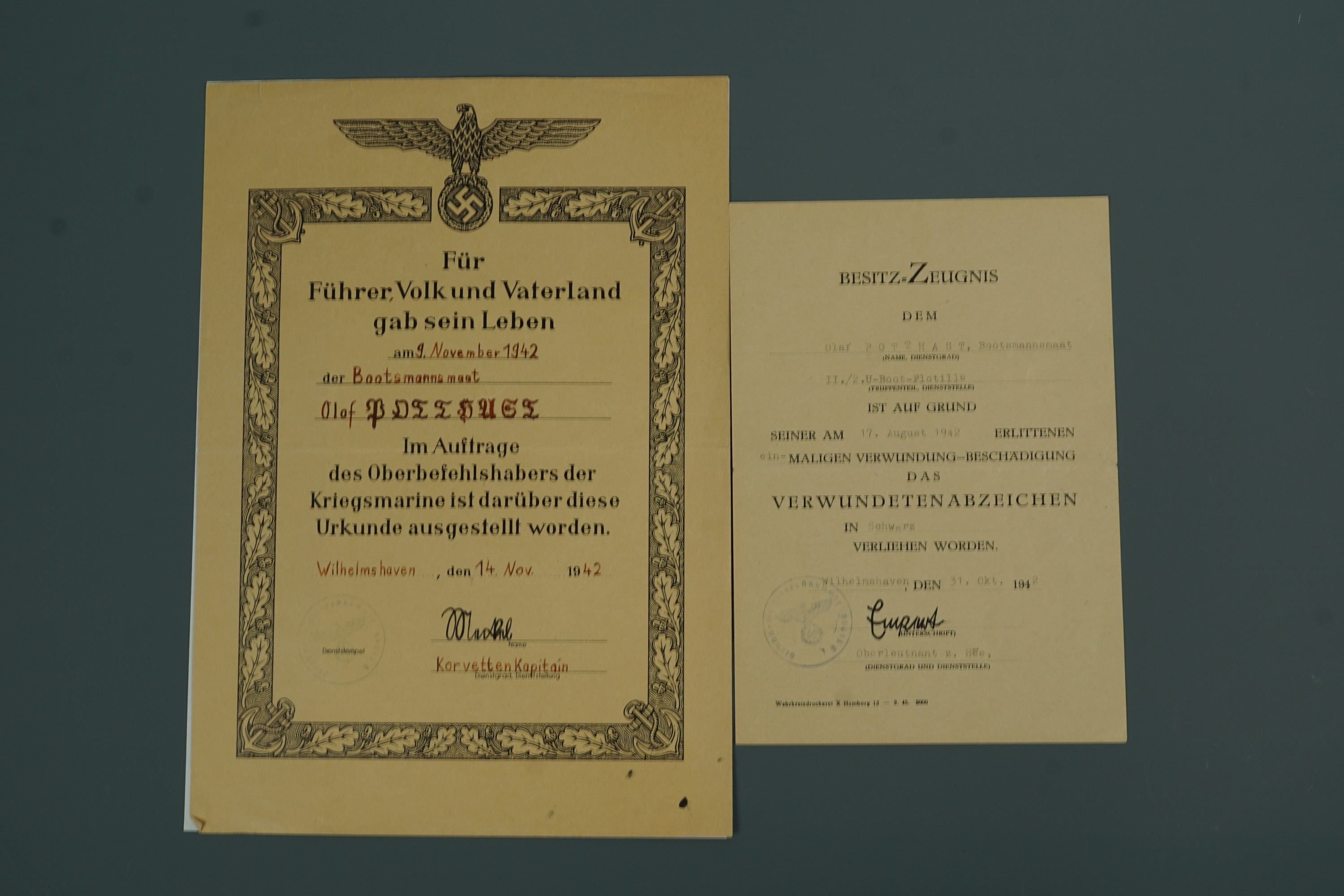 A Second World War German award document for the black wound badge together with a casualty document