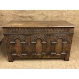 A reproduction joined oak bedding chest