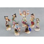 Seven Sitzendorf monkey band figures