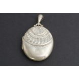 A Victorian Egyptianate oval silver locket, Payton, Pepper and Co, Birmingham, 1882, 12.5g