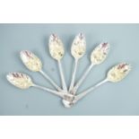 Six George III silver Old English pattern berry spoons, with later chased and engraved decoration