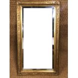A gilt rectangular mirror, 45 by 79 cm