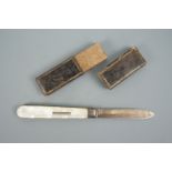 A Victorian silver pocket folding fruit knife, having knobbly mother-of-pearl grip scales, WN,