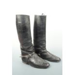 A pair of antique military officer's riding boots with spurs