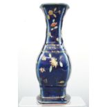 A Chinoiserie blue-glazed vase, enamelled in depiction of butterflies and gilt-enriched, 20 cm