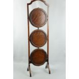 A mahogany folding cake stand