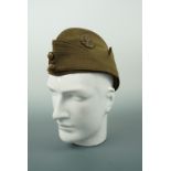 A Field Service cap with Royal Flying Corps buttons and badge