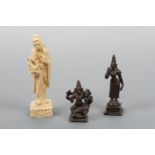 Two small 20th Century south Asian bronze figures and a Chinese faux ivory figurine, 13.5 cm