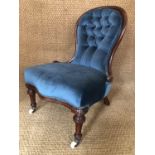 A Victorian button-upholstered mahogany nursing chair