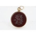 A Victorian fob seal, the carnelian matrix bearing an intaglio monogram