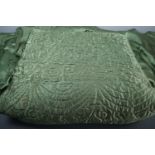 A vintage hand-stitched green satin quilted single bedspread