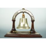 A late Victorian oak dinner gong with brass mounts, 26 cm high