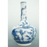 A Chinese blue and white porcelain bottle vase, decorated in depiction of dragons amongst clouds,
