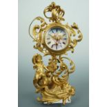 A late 19th Century Rococo gilt metal table clock, having an un-attributed spring-driven movement