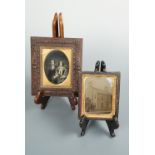 Two Victorian tinplate photographs, including one of a lady and gentleman clasping hands, the lady