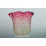 A Victorian vaseline glass oil lamp shade, of diaper-moulded bellflower form exhibiting pink and
