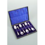 A cased set of six Edwardian silver coffee spoons, having shaped terminals with moulded C-scroll