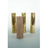 A 1943 75 mm M18 brass shell case, two Great War French 75 mm shell cases and a 1915 18-pounder