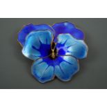 A David Andersen basse taille enamelled white metal brooch, modelled as pansy flower blossom in