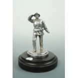 A vintage car mascot modelled as and entitled "Lifeboat-Man", on turned and ebonized base, 11.5 cm