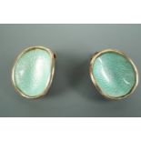 A pair of 1960s Norwegian enamelled white metal clip earrings, each of concave shell-like form, pale