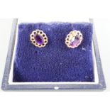 A pair of 9 ct gold mounted amethyst stud earrings, 9 mm x 7 mm