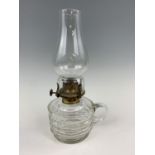 A Victorian cut glass finger oil lamp, 27 cm to top of funnel
