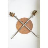 A reproduction Scottish highland targe and two broadswords