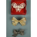 Italian and Portuguese white metal filigree brooches in the form of a butterfly and bow