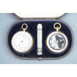 A late Victorian cased pocket magnetic compass and aneroid barometer / altimeter, the fitted red