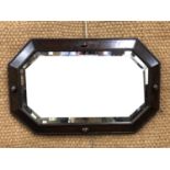 A carved oak framed bevel edged mirror, 80 x 50 cm