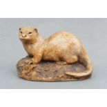 A Wildlife Studio otter figurine