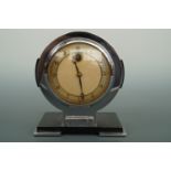 An Art Deco Smith's electric mantel or table clock, in chrome and ebonized wood, circa 1930, 15 cm