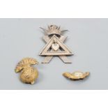 A large Masonic or similar electroplate jewel, together with a Northumberland Fusiliers cap badge