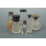 A number of Victorian and later silver-mounted glass scent and toiletry bottles together with one
