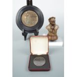 A small cold cast bronze bust of an early aviator, together with a Great War commemorative and a