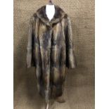 Two fur coats, (no size labels attached)