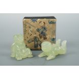 Two Chinese jade babies and a silk-work-covered box, latter 7 x 7 x 4.5 cm