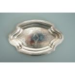 A George V silver pin dish, guilloche and hand engraved with scrolling garlands over a linear