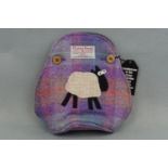 A Harris Tweed tea cosy, tagged as-new