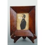 A Victorian profile portrait of a gentleman, water colour, in contemporary broad oak frame, 22 cm