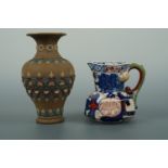 A Victorian Davenport Stone China serpent-handled jug together with a Doulton Silicone Ware vase,