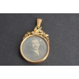 A late 19th / early 20th Century yellow metal double-faced open locket, having a circular bezel with