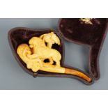A 19th Century meerschaum pipe, the bowl surmounted by a carved palm tree and lion, the latter