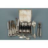 A set of silver-handled nutcrackers, silver-handled tea knives and sundry items of electroplate