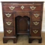 A Victorian reproduction mid-18th Century mahogany knee-hole dressing chest / desk