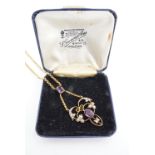 A Belle Epoque rolled-gold and amethyst coloured glass pendant necklace