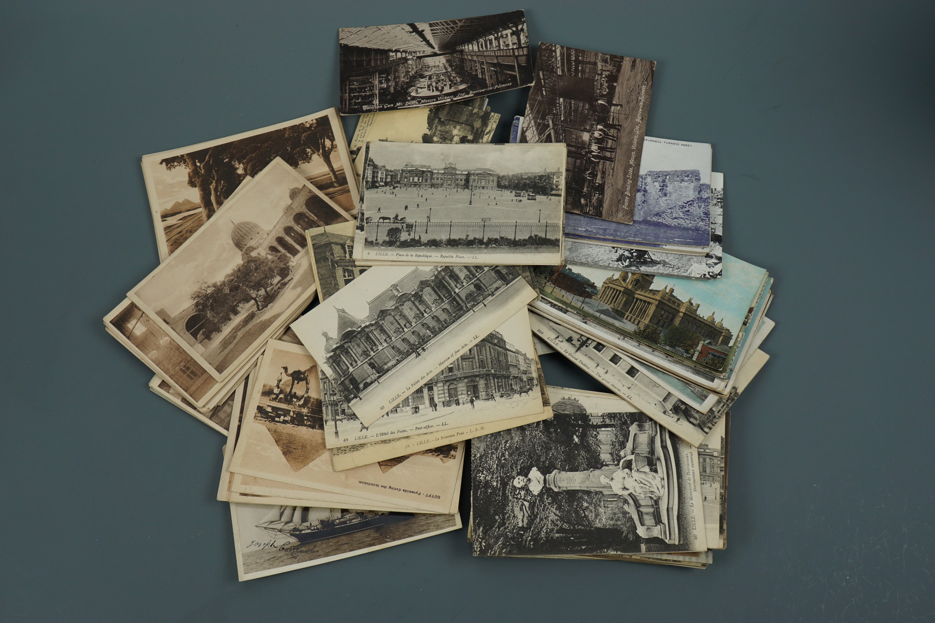 A quantity of early 20th Century postcards including photographic views inside Vickers Ltd, Barrow