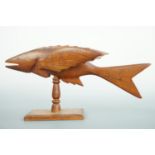 A Pitcairn Islands carved wooden model of a flying fish, inscribed "Souvenir from Pitcairn Island" /