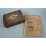 An album and decorative box containing a quantity of late 19th Century and other postcards